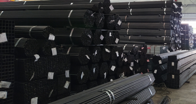 CLOSE-UP OF WAREHOUSE STEEL PIPES - STEEL TUBES